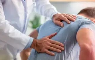 patient undergoing posture alignment therapy for pain relief