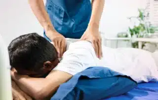 physical therapist guiding patient through posture correction exercises